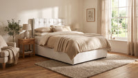 white fabric bed in a room setting