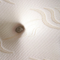 close up of cream and brown mattress