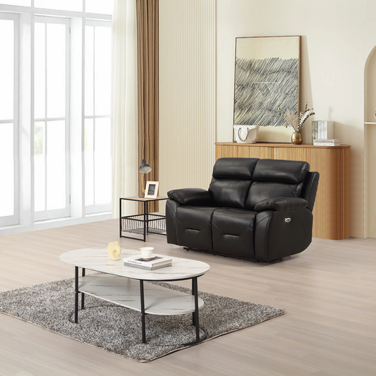 Renato black two-seater sofa in a modern living room setting, styled with neutral décor, soft lighting, and contemporary furnishings.