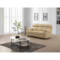 Renato cream three-seater sofa in a modern living room setting, styled with neutral décor, warm lighting, and contemporary furnishings.