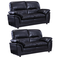 Two black leather sofas on a white background