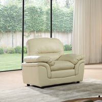 Beige recliner chair in a room with large windows and curtains.