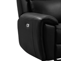 Close-up of a black leather recliner chair on a white background