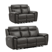 Two gray reclining sofas on a white background