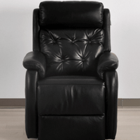 Black leather recliner chair on a plain background
