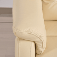 Close-up of beige leather car seat with stitching detail