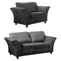 Two gray upholstered chairs on a white background