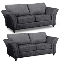 Two identical gray sofas on a white background