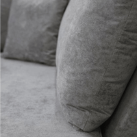 Gray textured pillows on a gray sofa