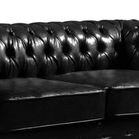 Black leather Chesterfield sofa on a white background