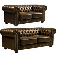 Two brown leather sofas with tufted backrests on a white background