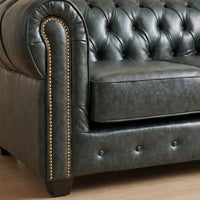 Chesterfield Green Leather Antique 2 seater sofa close-up of the arm, nailhead trim and turned wooden leg