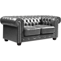 Gray tufted sofa on a white background