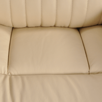 Detailed close-up of the Cidliano cream armchair showcasing upholstery texture and craftsmanship.
