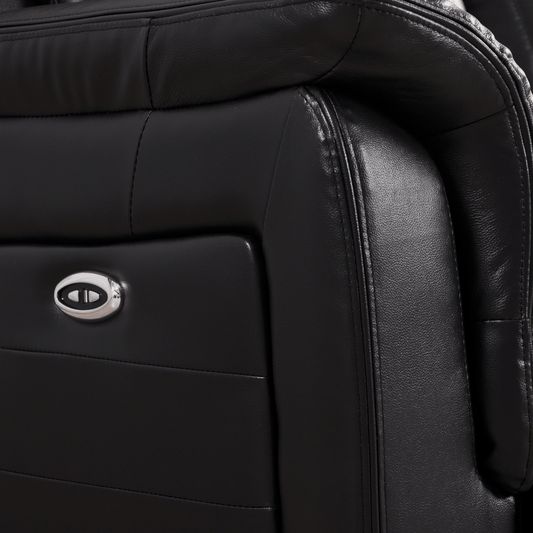 Closeup of Cidliano black armchair showing texture and details on white background.