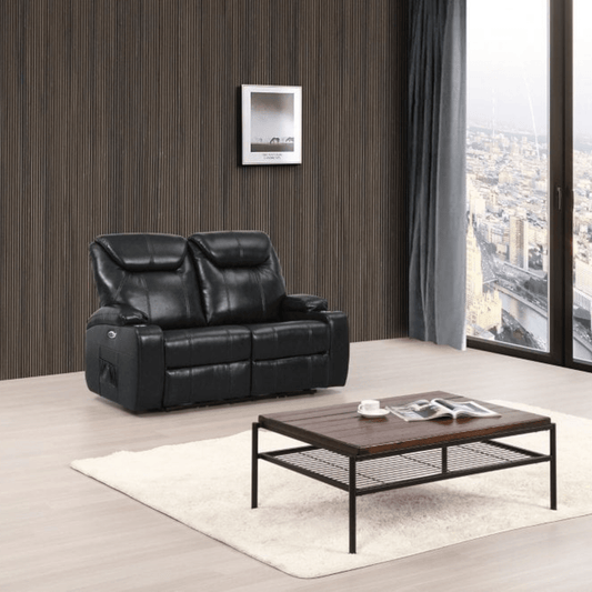 Black leather sofa in a living room with a wooden coffee table and city view.