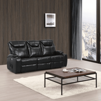 Black leather sofa in a living room with a wooden coffee table and large window.