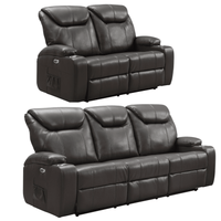 Two black leather recliner sofas on a white background