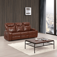 Brown leather sofa in a living room with a coffee table and city view.