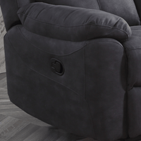 Grey recliner chair with a wooden floor background