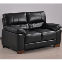 Dalmore Black 2 Seater Sofa – Angled view in a cozy room setting, showcasing plush black fabric and modern styling.