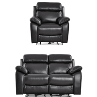 Black leather recliner chair and loveseat set on a white background