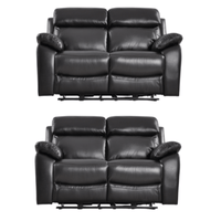 Two black leather recliner sofas on a white background