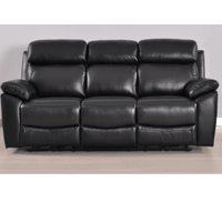 Black leather sofa on a wooden floor with a plain background
