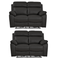 Two black leather recliner sofas on a white background