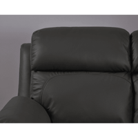 Close-up of a black leather sofa against a gray background