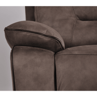 Close-up of a brown leather sofa armrest on a gray background