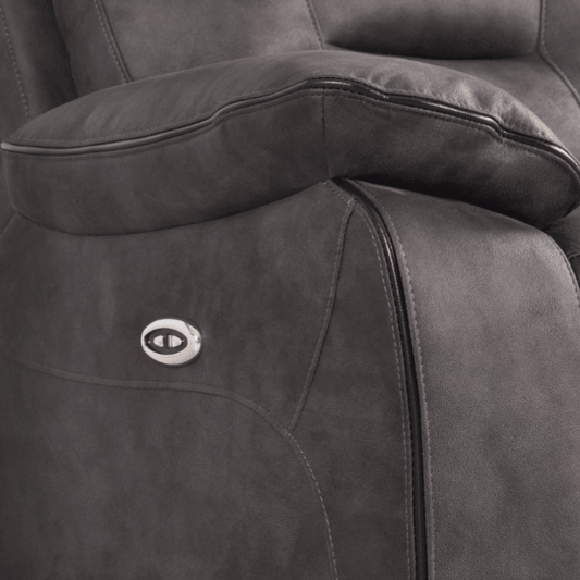 Gray recliner chair with a visible brand logo on the armrest.