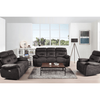 Gray sofa set in a living room with a coffee table and decor items.