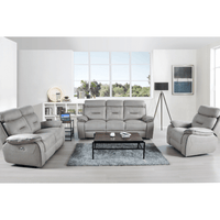 Gray sofa set in a modern living room with a coffee table and decor items.
