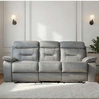 Gray sofa in a living room setting with a neutral wall and decor.
