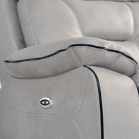 Close-up of a gray car seat with a visible brand logo.
