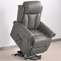 Gray recliner chair on a light wooden floor with a white wall background