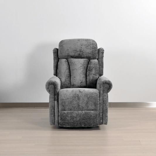 Gray recliner chair in a room with a plain background