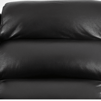 Close-up of a black leather sofa