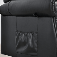 Close-up of a black leather recliner chair