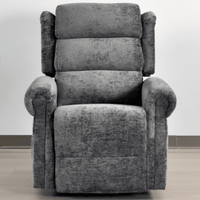 Gray recliner chair on a light wooden floor with a white wall background