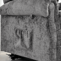 Gray upholstered chair with visible wear and tear on a white background