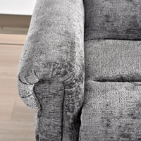 Gray textured fabric on a piece of furniture with a visible brand logo.