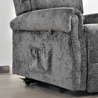 Gray fabric recliner chair with armrest on a wooden floor.