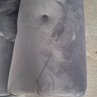 close up of grey velvet 2 seater sofa