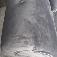 close up of grey velvet 2 seater sofa
