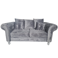 grey velvet 2 seater on a white background