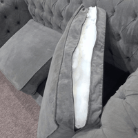 Gray sofa with a visible cushion and seat structure.