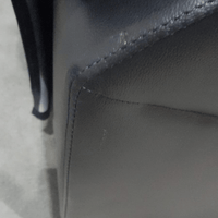 close up of marks on black leather sofa