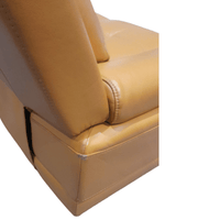 Close-up of a beige leather seat with stitching detail on a white background